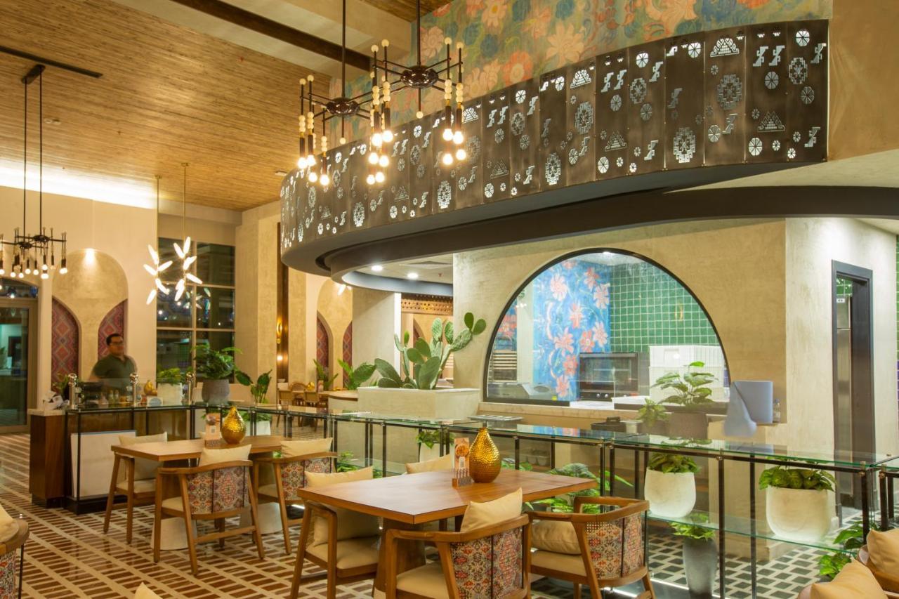 Citadines Abha Aparthotel Exterior photo The interior of the restaurant